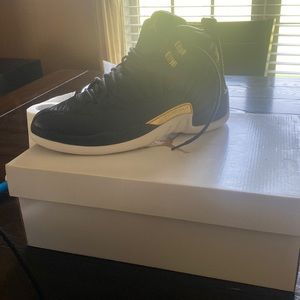 Selling woman’s Jordan 12 black and white and gold.